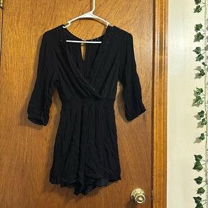 black romper with deep v line with a half sleeve